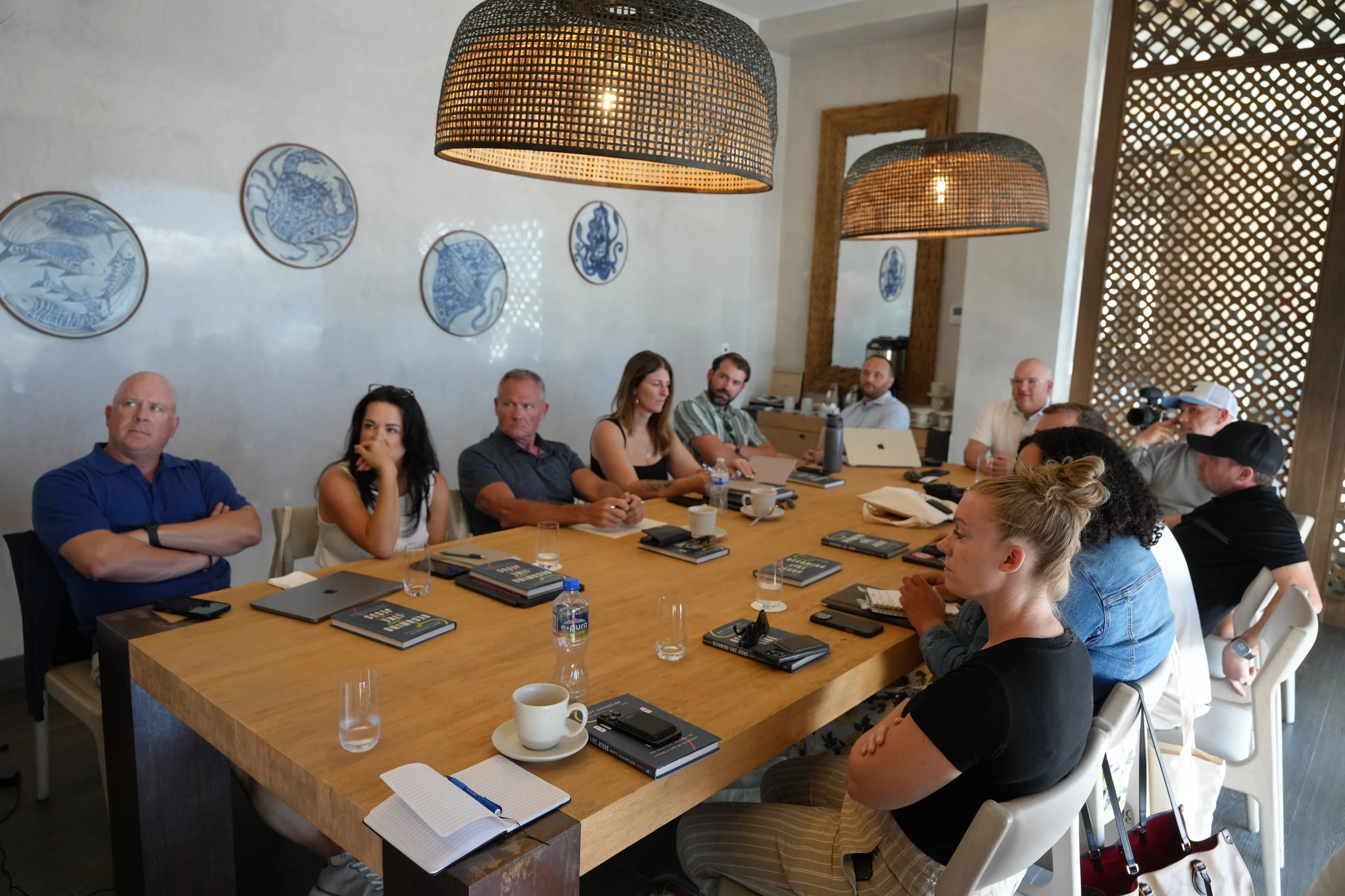 Participants around a boardroom table during a working discussion at the EPIC founder gathering in Cabo